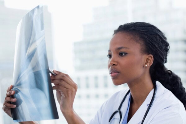 depositphotos 10338157 stock photo focused female doctor looking at