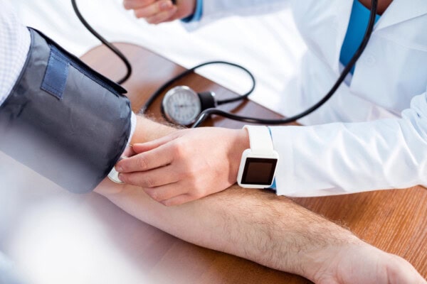 stock photo doctor measuring pressure of patient