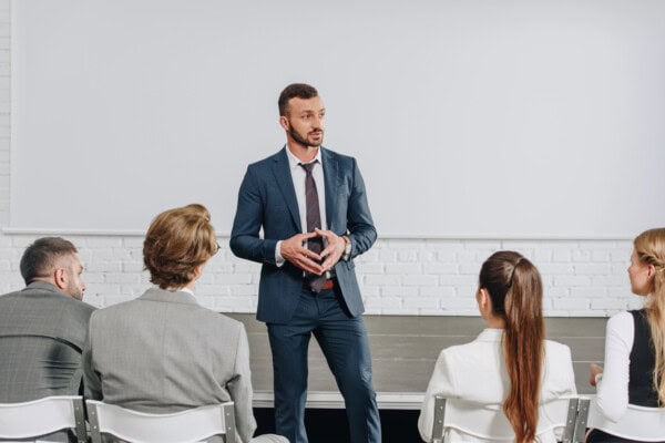 depositphotos 209195854 stock photo pensive business trainer looking away