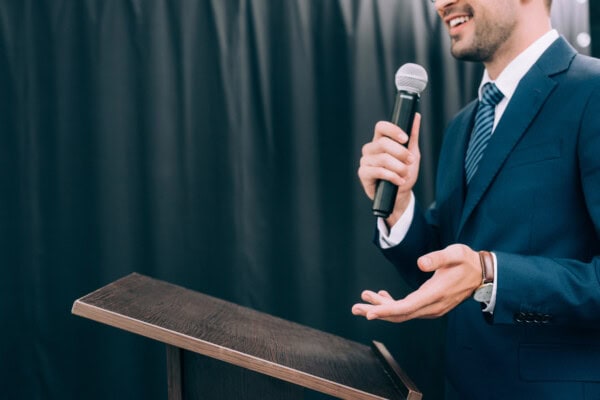 depositphotos 219683950 stock photo cropped image speaker gesturing talking