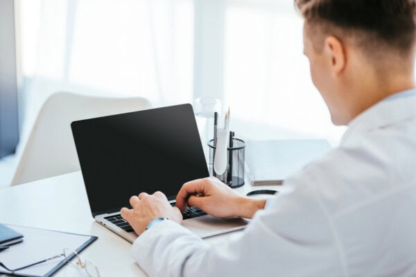 depositphotos 257722816 stock photo selective focus doctor using laptop