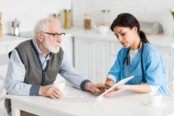 depositphotos 270652244 stock photo grey haired man talking nurse