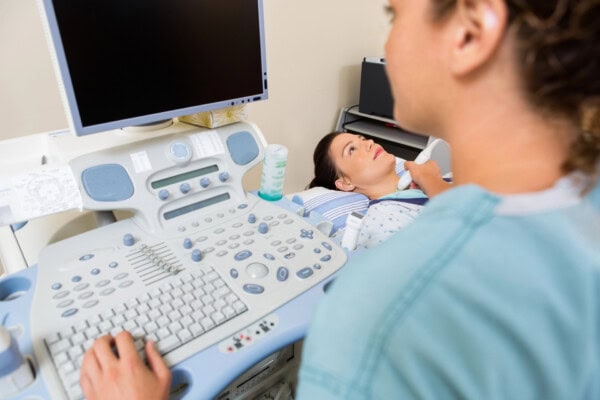 depositphotos 36128349 stock photo nurse using ultrasound treatment on