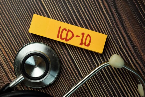 depositphotos 426791350 stock photo icd write sticky note stethoscope