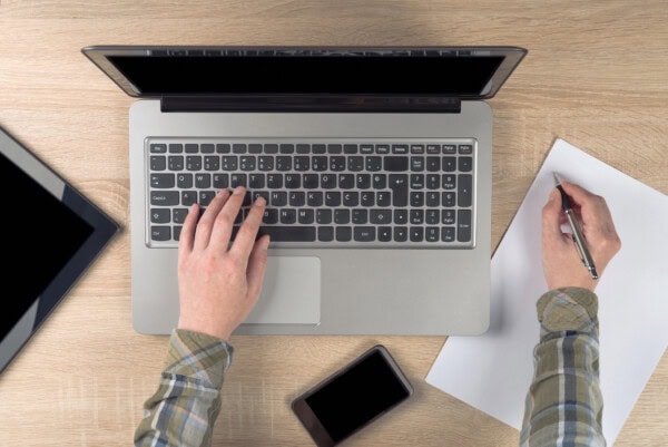 depositphotos 52447805 stock photo programmer writing notes on paper