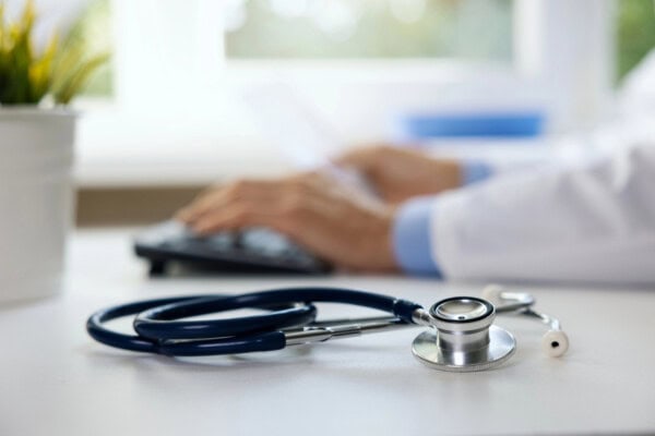 depositphotos 675804044 stock photo stethoscope table clinic office doctor