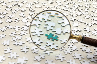 magnifying glass and puzzles